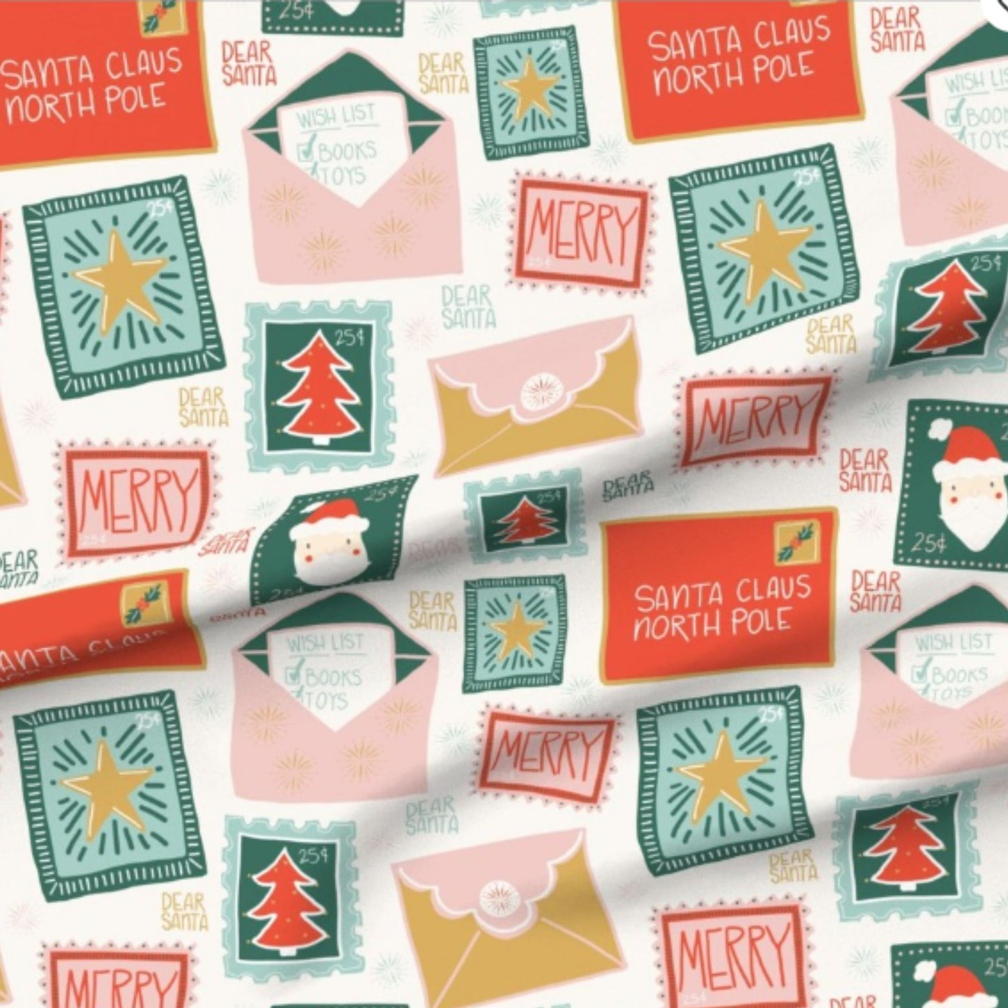 Close-up of the Letters to Santa postal print in red, pink, green and gold for the personalised Signature Santa Sack